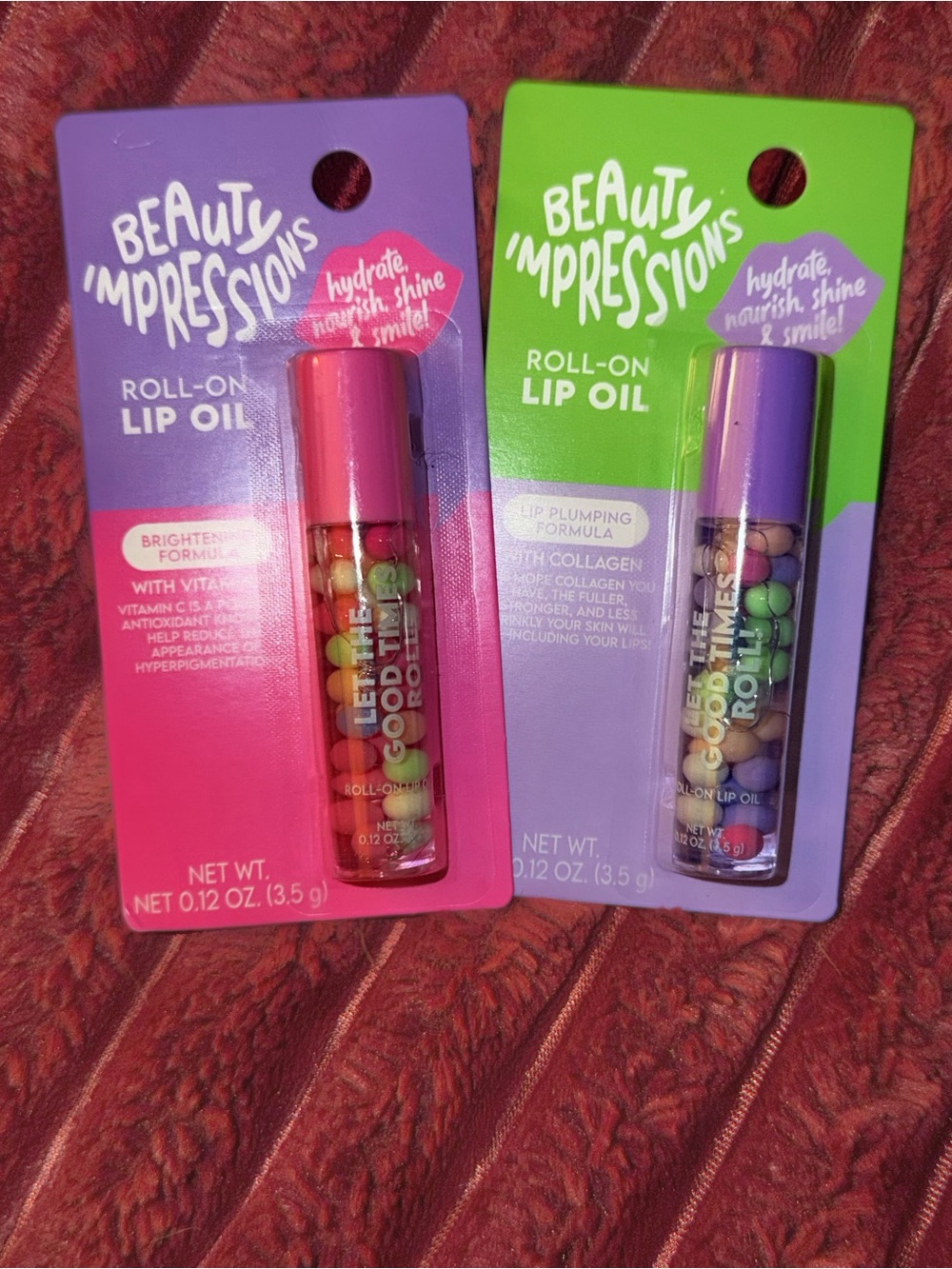 Lot of two Beauty Impressions Roll-On Lip Oil Duo - Pink & Purple Caps